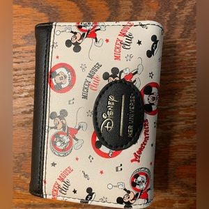 Her Universe Mickey trifold wallet.  Practically new!  Only used for a 2 weeks.